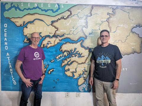 John and Eric at the ITA office in Bissau