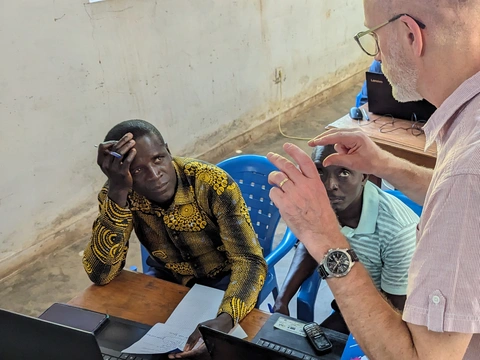 John working with Djola Felupe WMs