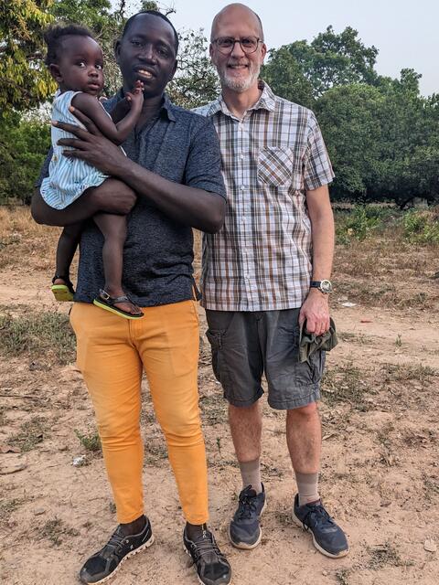 John with Lendem site manager Joel and daughter