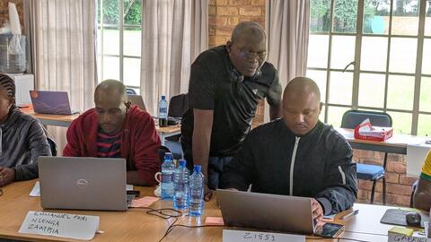 Francis helping students as they create their first page