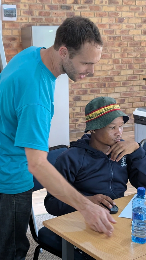 Roman helping a student