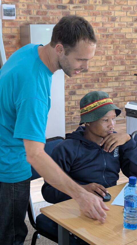 Roman helping a student