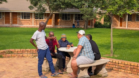 Students gather outside the meeting room during break time