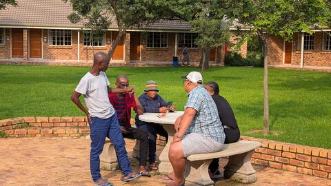 Students gather outside the meeting room during break time