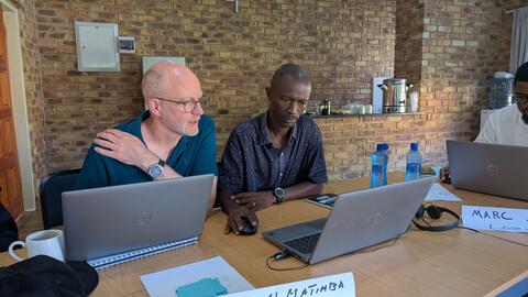 John helps a student