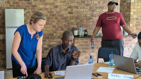 Emilee helps a student