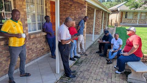 Students take a nervous break before presenting their sites