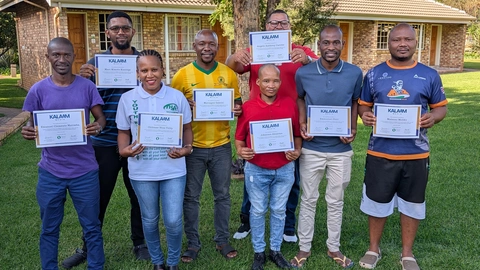 Group photo with certificates