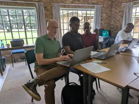 John working with Mashi student