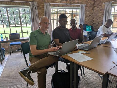 John working with Mashi student