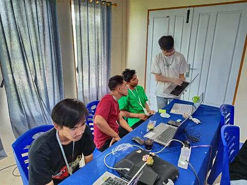 Basil helping a participant