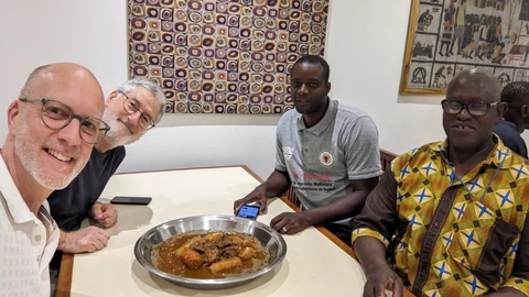 Eating from a shared dish: millet couscous and beef