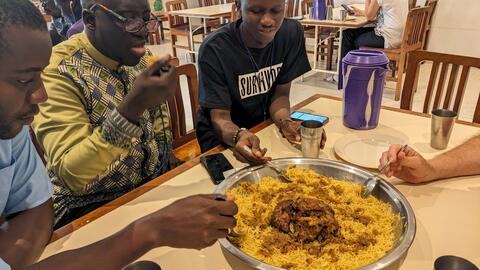 Eating from a shared dish: chicken and vermicelli