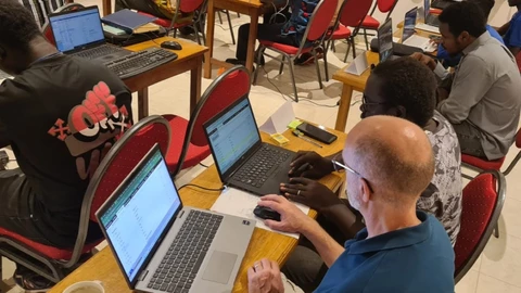 John working with the Gambian Karon trainee 