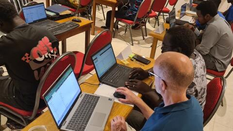 John working with the Gambian Karon trainee 