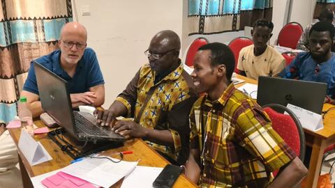 John working with the Manjac team