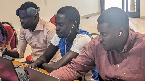 Wolof & Bandial trainees hard at work, Josué (SIL) lending a hand