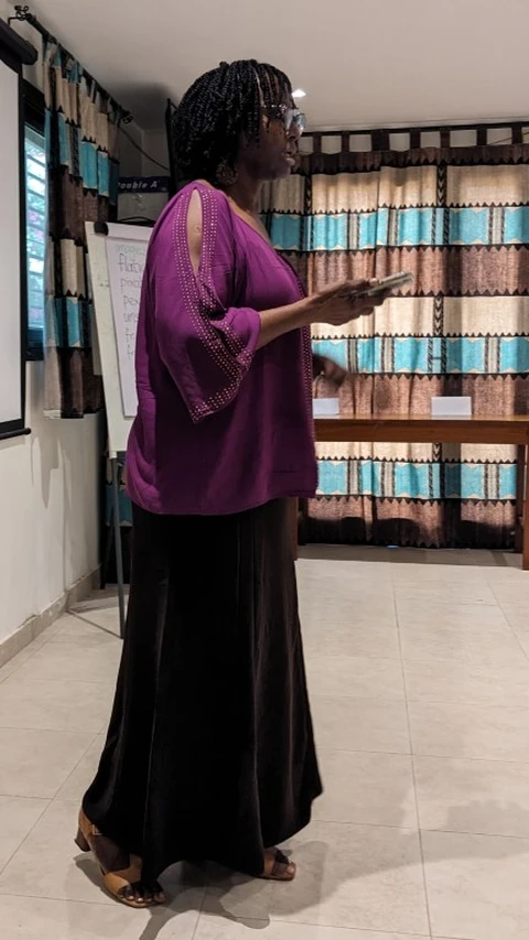 Workshop organizer Sophie addresses guests at the celebration