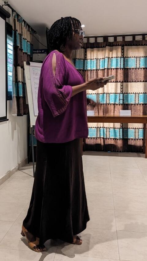 Workshop organizer Sophie addresses guests at the celebration