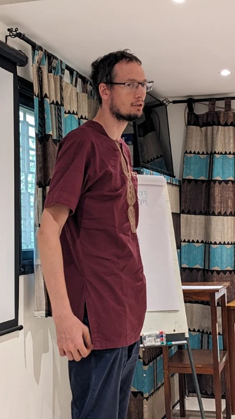 SIL Senegal director David Wilkinson addresses guests at the celebration 