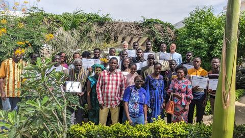 Group photo of guests & trainees (obscured by the plants!)