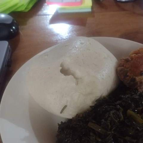 Fufu with greens and chicken