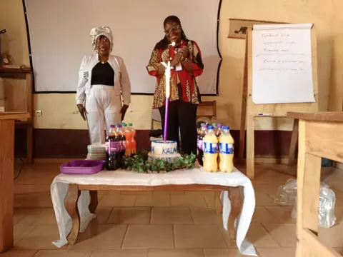 Lighting the candle on the celebration cake